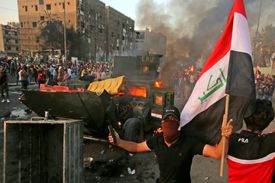 افزایش تلفات اعتراضات عراق به ۱۰۰ نفر + عکس