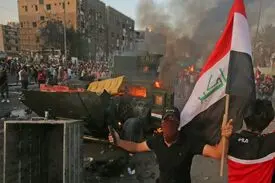 افزایش تلفات اعتراضات عراق به ۱۰۰ نفر + عکس